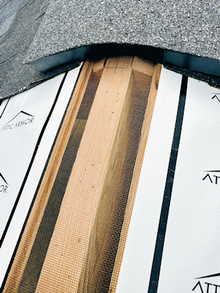 The same ridge sealed tight with Attic Armor installed under the vent